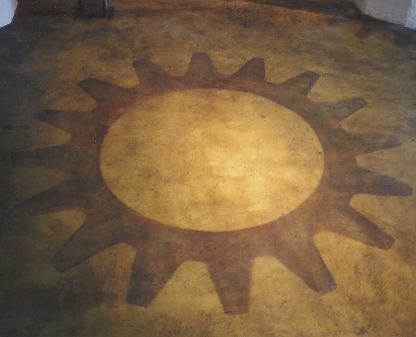 Decorative floor painting faux finish and large gear graphic