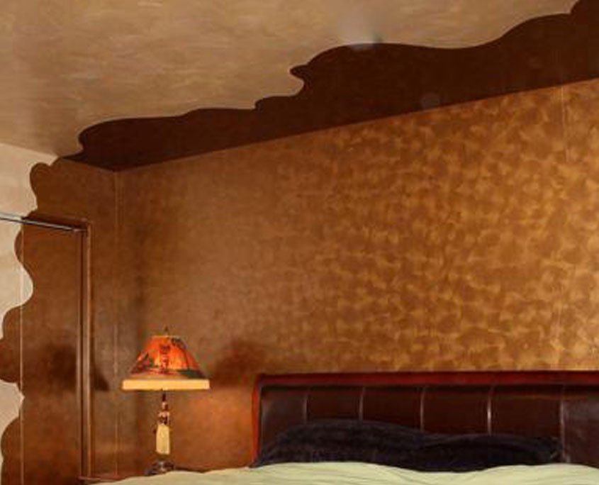 Copper metallic decorative painting on wall of bedroom
